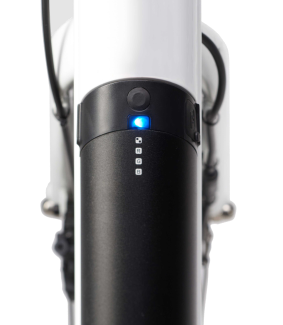 Close-up of a black cylindrical device with blue light and four white icons on a white pole.