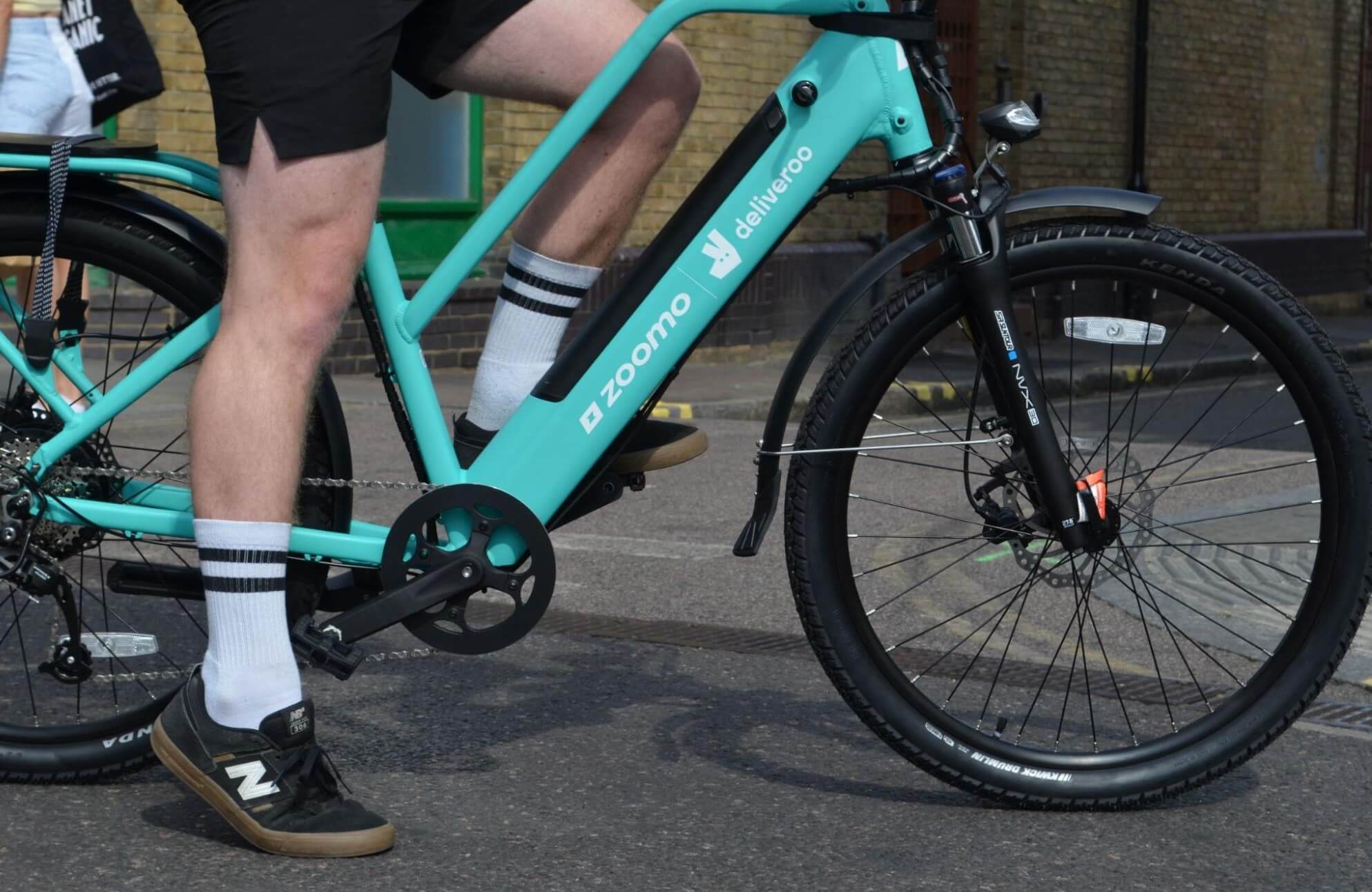 Deliveroo rider using a Zoomo e-bike